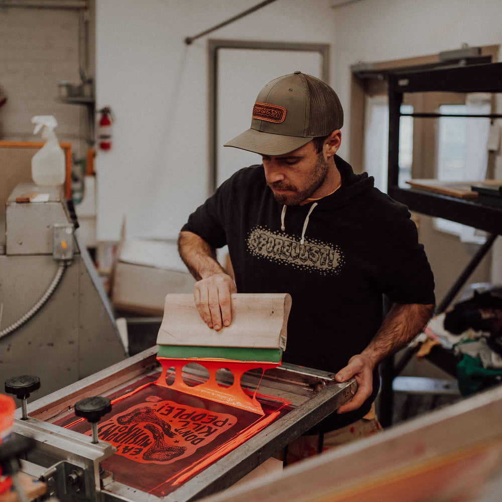 Chris Adams screen printing in the Corvallis, Oregon studio